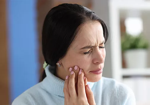 Woman experiencing tooth pain